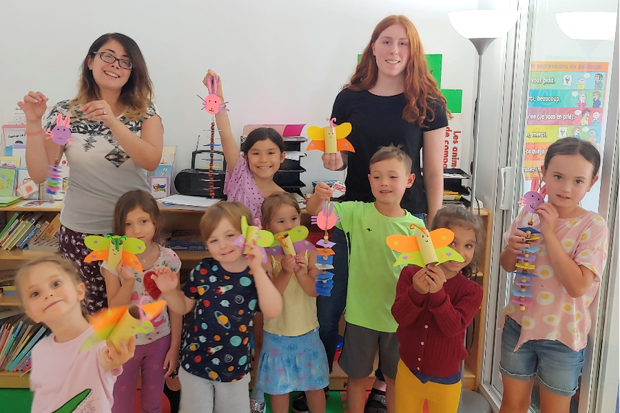 Kids enjoying their arts and crafts activity during French summer camps!